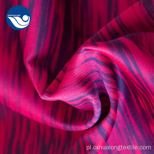 Różowo-czarna ziarnista dzianina żakardowa z nadrukiem tekstylnym